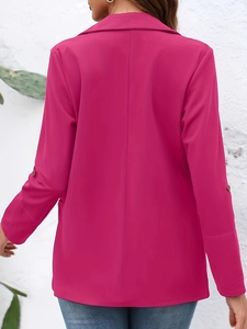 Detail view of rose red fitted blazer showing stitching and lapel back profile