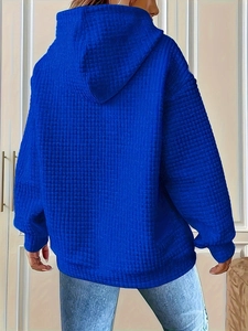 Back view of a royal blue waffle texture hoodie for women with relaxed fit and hood