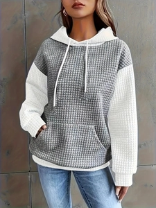 Women's color block waffle knit hoodie featuring white sleeves and grey kangaroo pocket