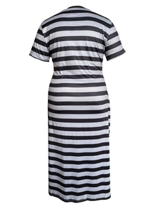 Back view of a long black and white striped dress with short sleeves and a round neck