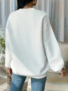 Women's white waffle knit oversized sweatshirt with drop shoulder and ribbed crewneck