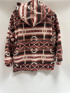 Close-up of bohemian geometric print on women's hooded fleece jacket for autumn