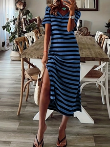 Detail of blue and black striped maxi dress featuring a V-neck and stylish side slit