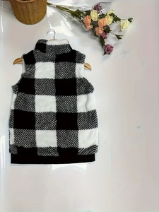 Women's plaid fleece vest with high collar and ribbed hem on a wooden hanger