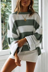 Detail view of oversized crewneck striped knit sweater in sage green and white