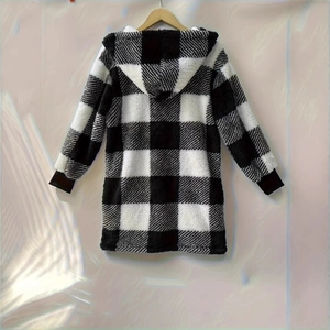 Detail of soft black and white buffalo check plush hooded jacket with elastic cuffs