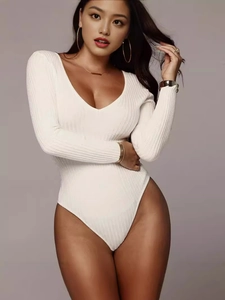 Slim fit white ribbed knit long sleeve bodysuit with deep V-neck for women