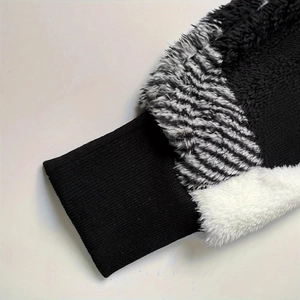 Detail of ribbed knit cuffs and plush fleece texture on long sleeve plaid hoodie