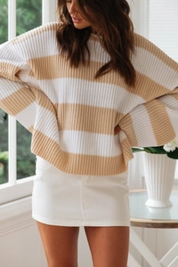Detail of soft khaki and white striped knit sweater with vertical texture and drop shoulder