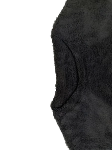 Close-up of soft black plush fabric texture on a long-sleeve casual sweatshirt for women