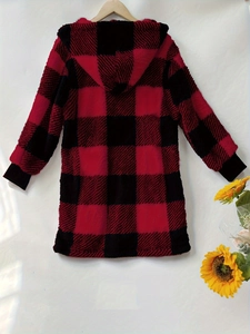Detail of red and black plaid plush hooded jacket with ribbed cuffs and warm texture