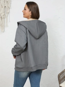Detail view of women's gray fleece-lined hoodie featuring soft faux shearling interior