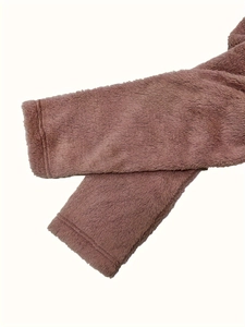 Detailed macro view of the soft plush faux fur cuff with durable double stitching seams