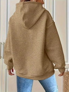 Detail of camel oversized hoodie with textured waffle knit fabric and dropped shoulders