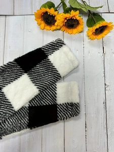 Women's plaid plush leg warmers in black and white check with cozy thick faux fur material