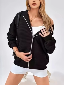Women black zip-up hoodie with textured fabric and contrast white zipper detail