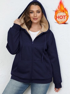 Women's dark blue zip-up hoodie with warm light brown fleece lining and drawstring hood