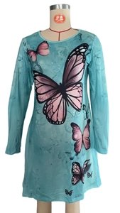 Close-up of elegant butterfly print on light blue long-sleeve round neck dress fabric