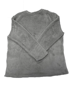 Detail of dark grey sherpa fleece texture on a loose long-sleeved crewneck sweatshirt