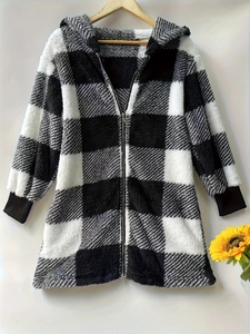 Detail of buffalo plaid plush hoodie featuring full zipper and black ribbed cuffs