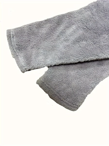 Close-up detail of soft grey plush fleece fabric texture for women's long sleeve sweatshirt
