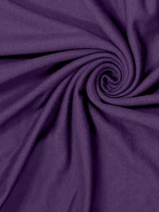 Close-up of deep purple velvet fabric showing soft texture and elegant light reflections