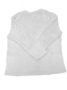 Detail view of the soft fleece fabric and plush texture on white long sleeve sweatshirt
