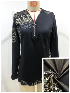 Women's black V-neck long sleeve top with floral mandala print and metal zipper detail