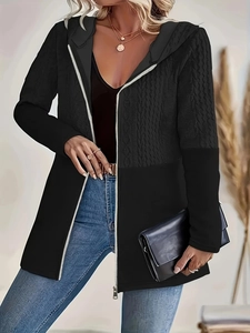 Women's black hooded zip-up jacket with textured cable knit patchwork design