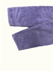 Detail shot of soft purple sherpa fleece fabric showing plush texture and dense material