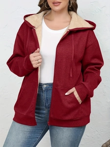 Detail of burgundy hooded jacket featuring thick plush fleece lining and drawstring hood