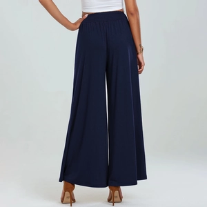 Rear view of navy high-waisted wide-leg trousers featuring elastic waistband and draping fabric