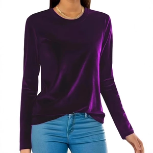 Detailed view of dark purple velvet long sleeve shirt with soft texture and rich sheen