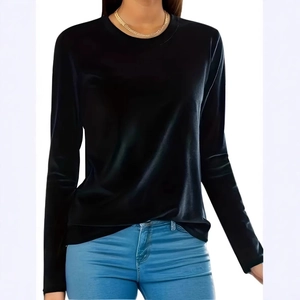 Detail of a women's long sleeve black top with a velvety texture and a casual round neck