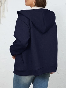 Detail view of the navy blue hooded jacket back with plush fleece lining and ribbed hem