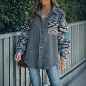 Detail of grey corduroy shirt with ethnic print long sleeves and button-down collar