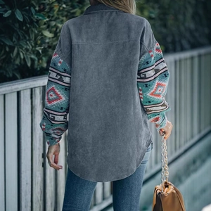Detailed back view of a corduroy coat with colorful geometric ethnic patterns on sleeves