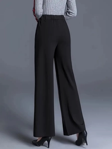 Rear side view of women's high-waisted black straight trousers with elegant drape