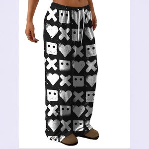 Detailed view of lightweight wide-leg trousers with heart and robot print and white drawstring