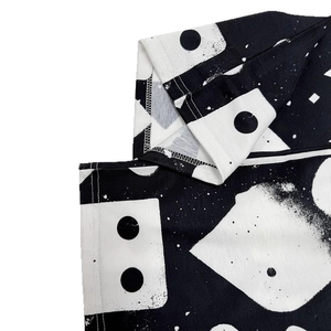 Detailed close-up of high-quality reinforced double-stitched seams on printed knit fabric