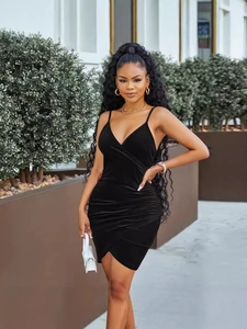 Elegant black velvet strap dress with deep V-neck and asymmetrical wrap hem for women