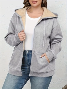 Detail of warm grey zip-up hoodie featuring cozy fleece lining and ribbed cuffs
