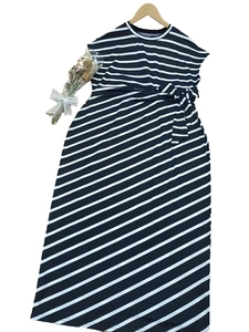 Sleeveless black and white striped maxi dress with waist tie and A-line silhouette