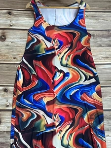 Sleeveless maxi dress with abstract red and blue fluid print on wooden hanger display