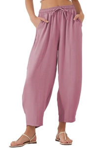 Detail view of high-waist loose pants with drawstring and waffle texture fabric