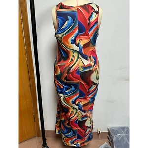 Detail view of a sleeveless maxi dress featuring a vibrant abstract fluid texture print