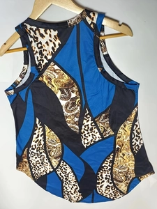 Close-up of leopard and paisley 3D print texture on sleeveless mini dress fabric