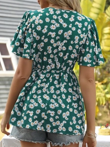 Back view of a green floral summer blouse with daisy print and ruffled sleeves detail