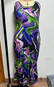 Detail of a sleeveless long dress in 1XL with vibrant abstract fluid swirl print pattern