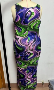 Detail of racerback maxi dress featuring purple and green marble wave print pattern